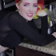 A pretty girl with wild dyed hair and tattoos records herself farting repeatedly while sitting on a kitchen counter top. Farting only. About 8 minutes.